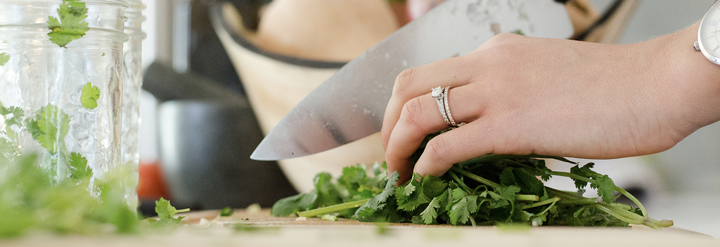 close-up of someone chopping herbs