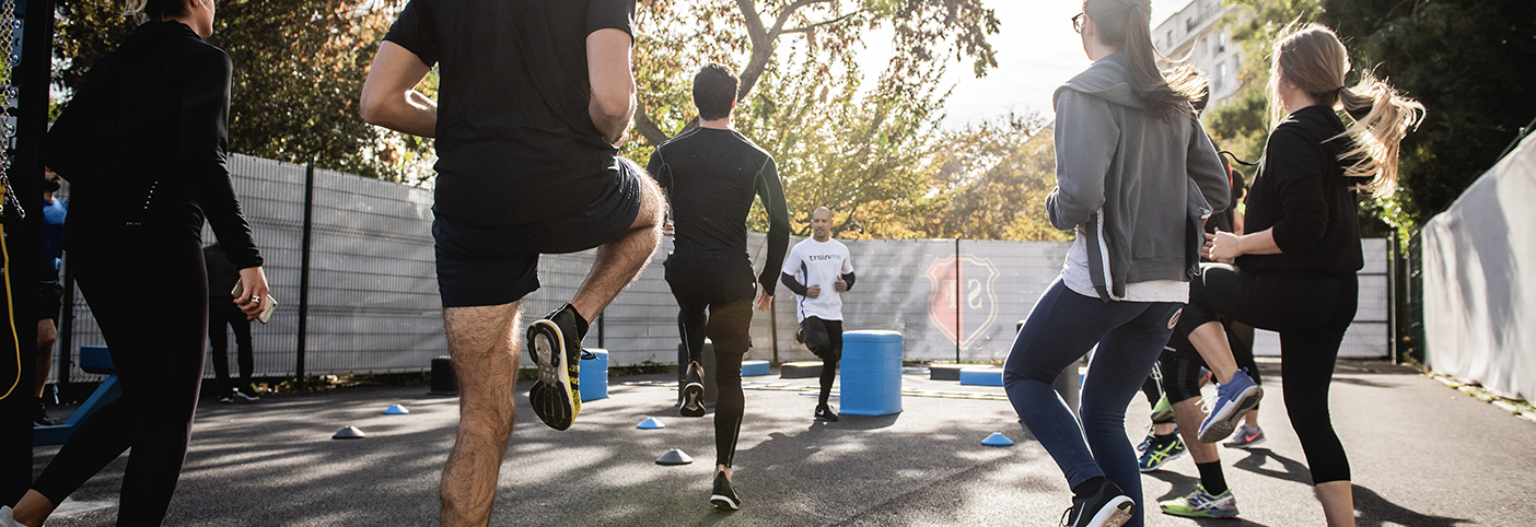 group of people warming up outside for exercise