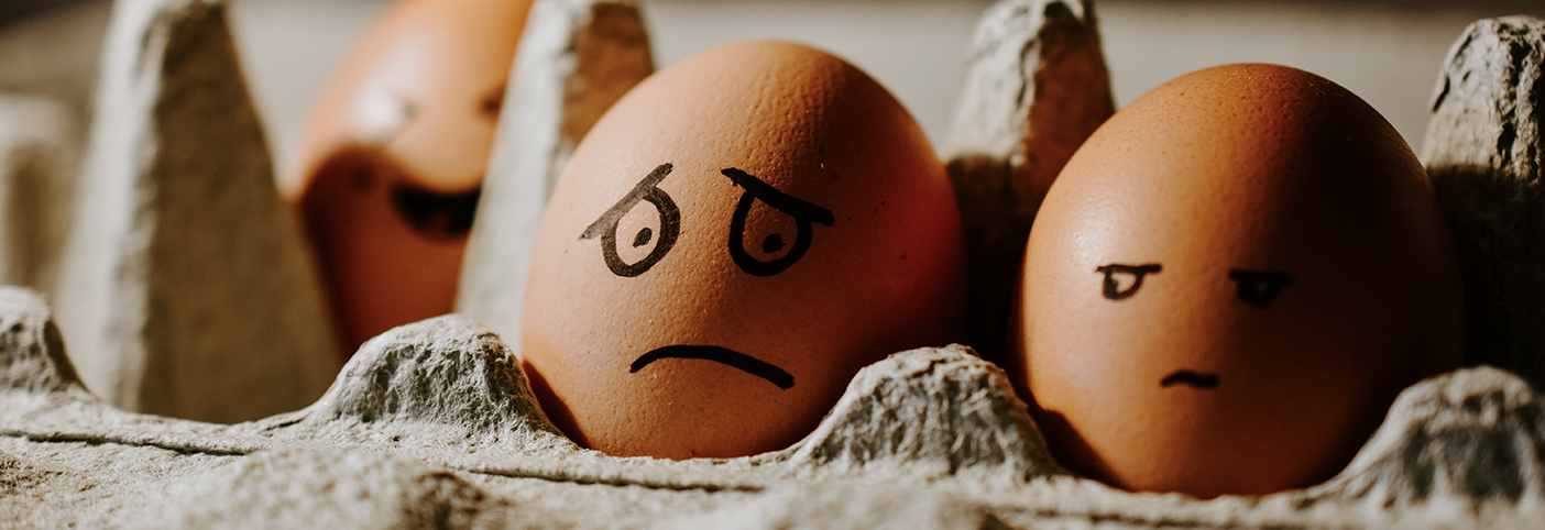 two eggs with worried faces drawn on them