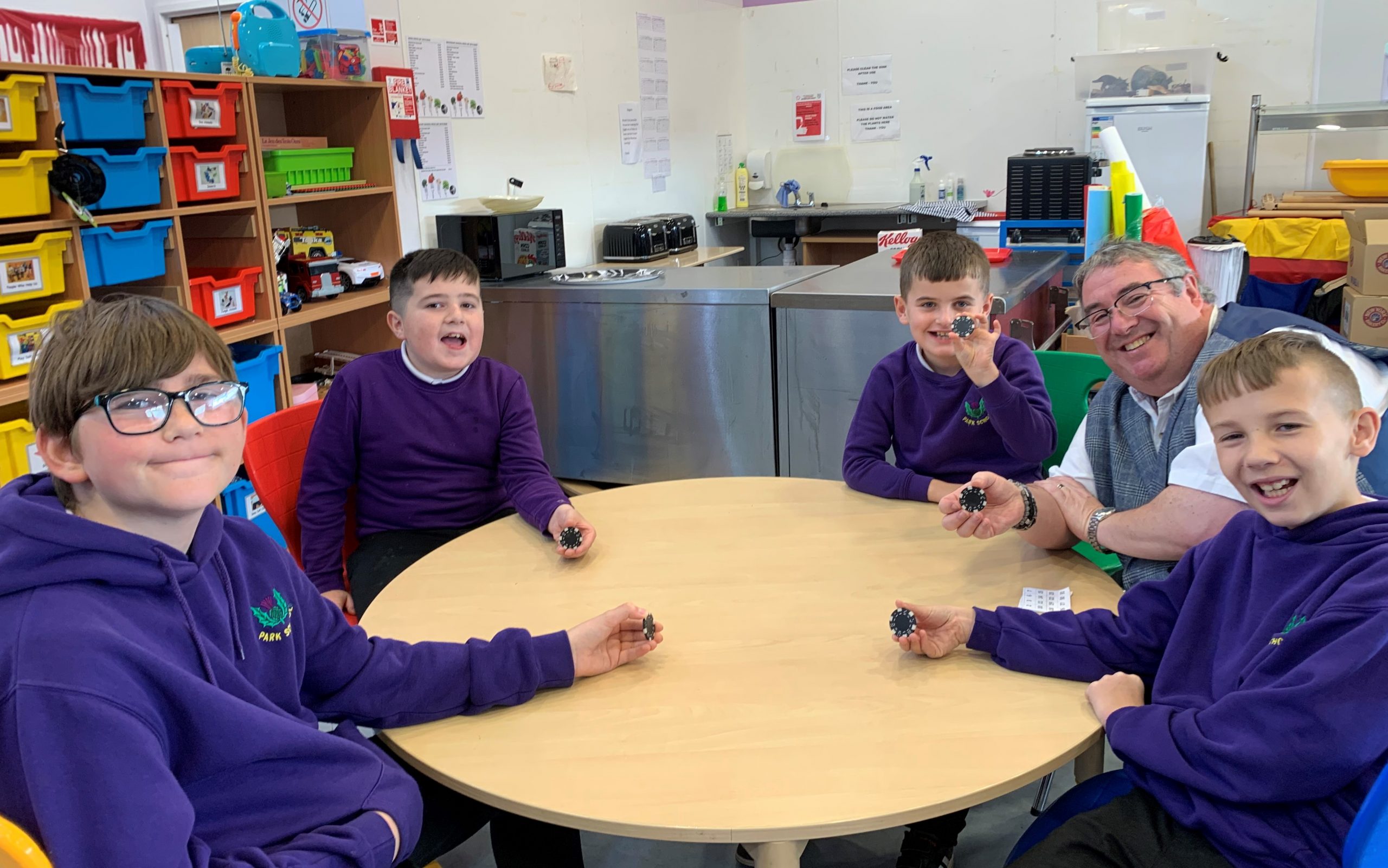 Scotty entertaining a group of children at a local primary school