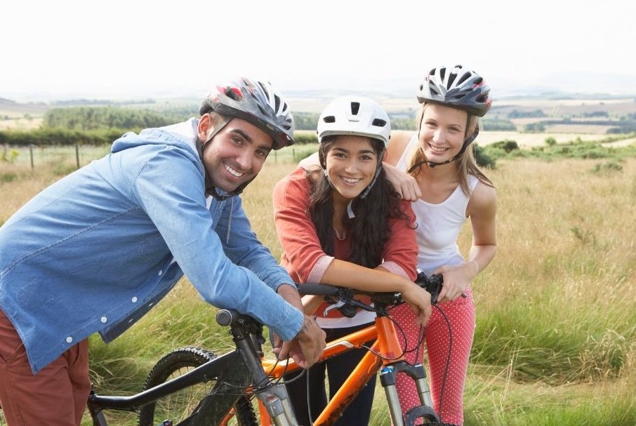 a group of cyclists taking a break together in the countryside