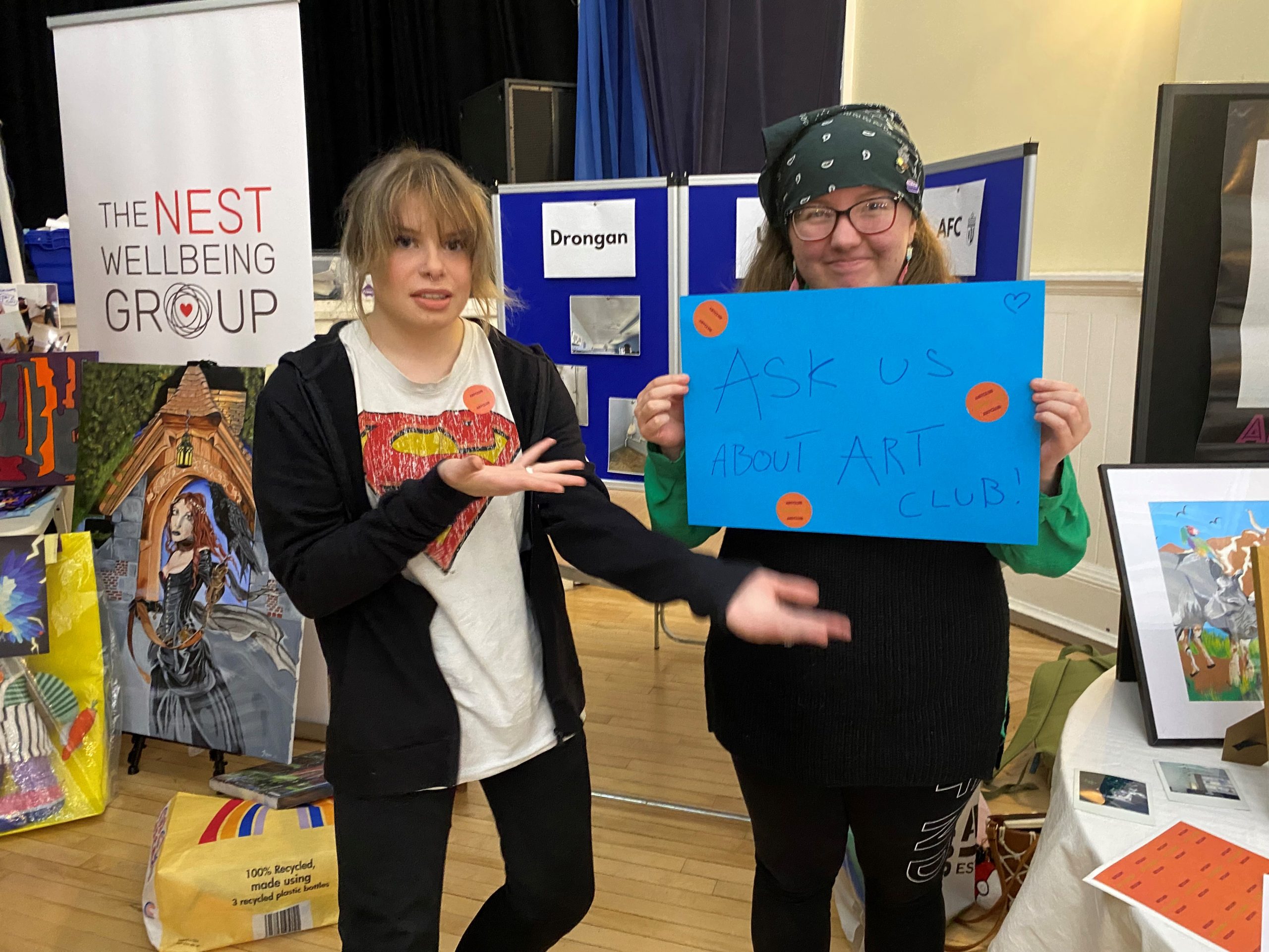 Jam and Emma from the art club proudly display their work at the Stewarton PB voting event
