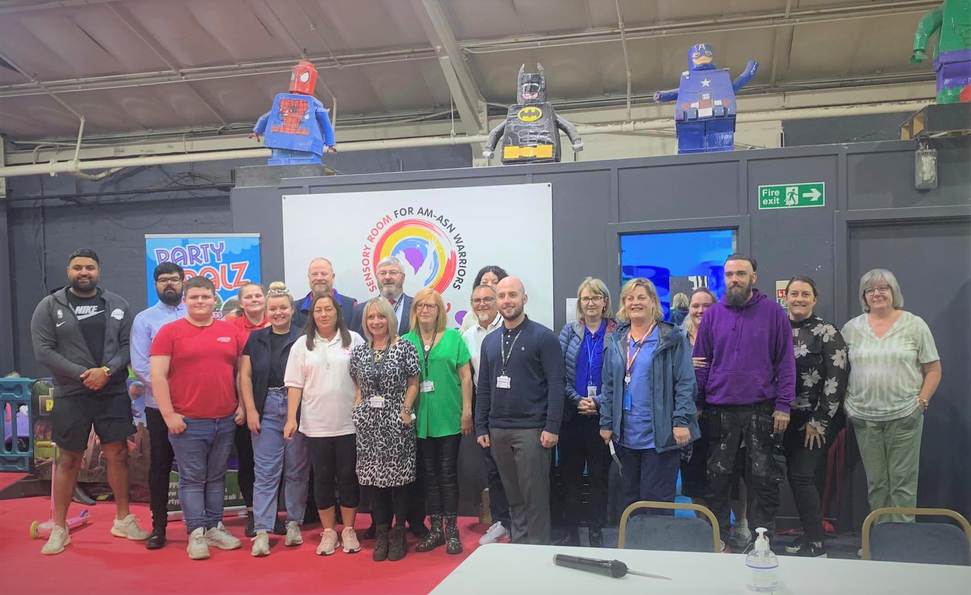 Members of Ayrshire Am-asn Warriors and staff in front of the new sensory room